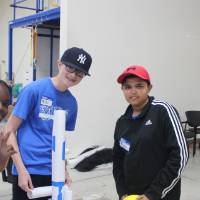 Students pose with their paper tower built for STEPS Physics Olympics